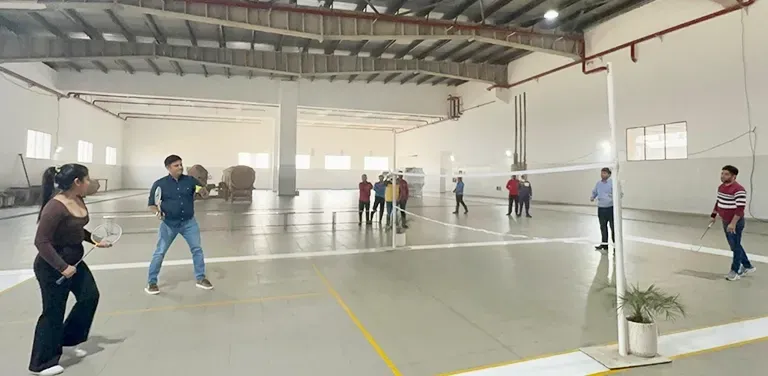 Haldiram's employees playing badminton at a facility