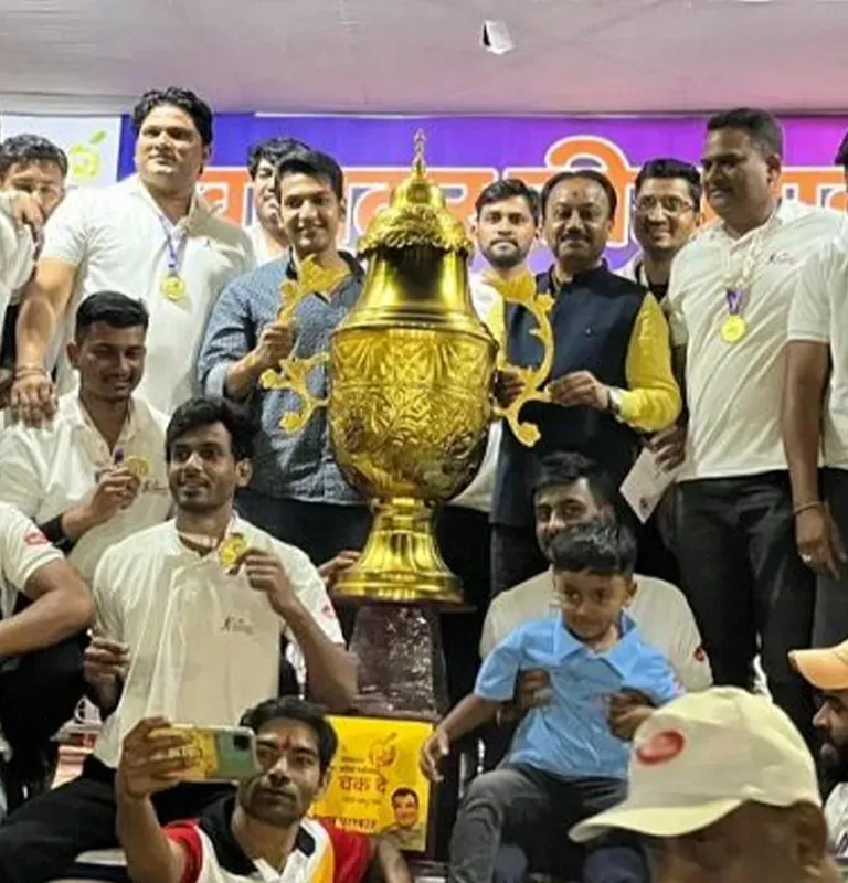 Haldiram's team celebrating a cricket tournament win with a trophy